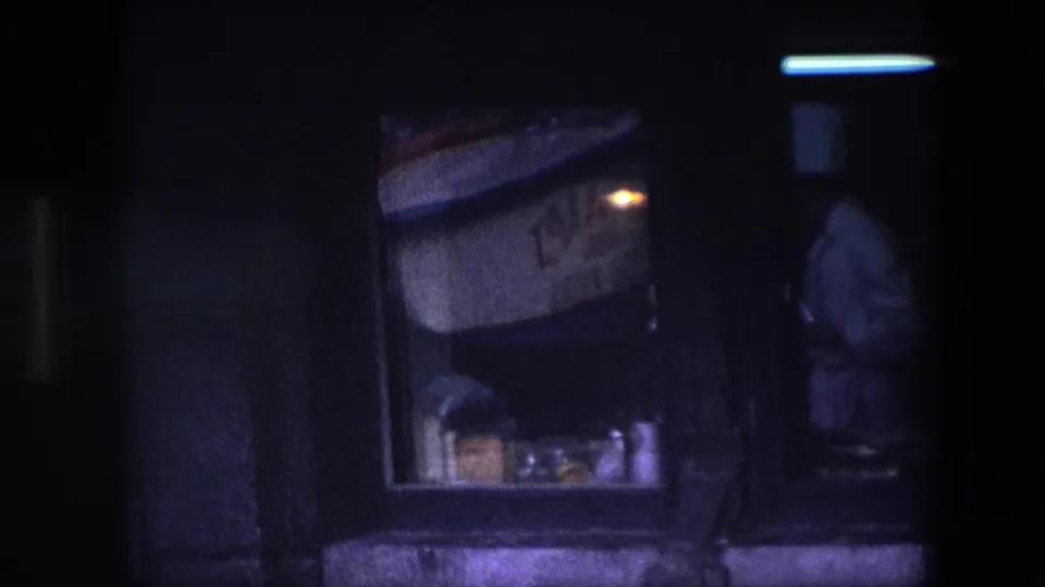 The final frame shifts darker, showing the sign and window area with the chef partly cropped and softened by shadow, glass, and 8mm motion blur.