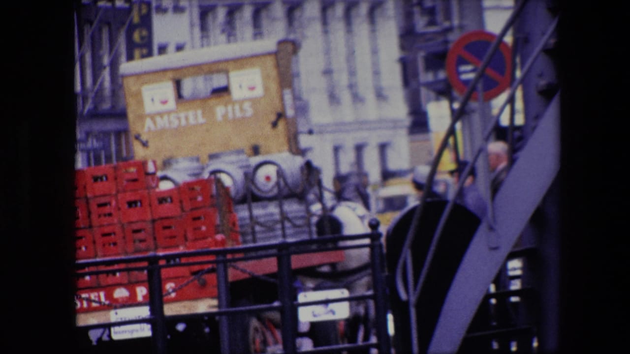 The final frame shows the Amstel Pils horse-drawn delivery cart with stacked red crates, metal kegs, a white horse, street railings, and partly visible people near the curb.