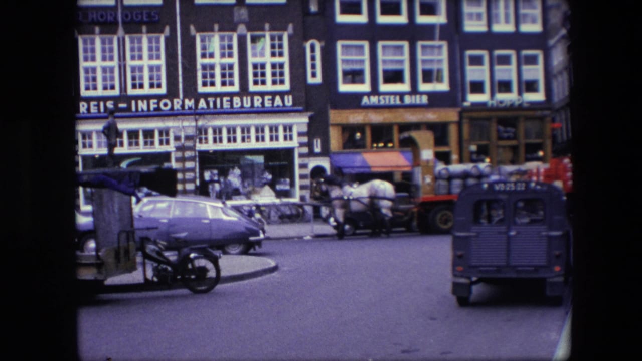 A 1967 Amsterdam street view shows a horse-drawn wagon near parked and moving cars, bicycles, a blue van, and storefront signs including an informatiebureau and Amstel Bier.