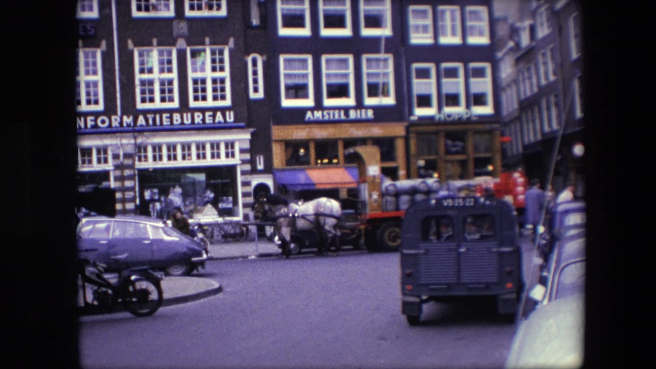 1967 Amsterdam street view with INFORMATIEBUREAU and AMSTEL BIER storefront signage, a horse-drawn barrel wagon, a blue Volkswagen Beetle, pedestrians, and a dark utility van.