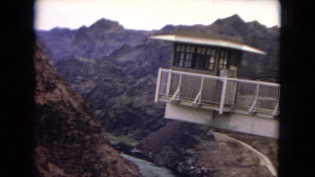 White-railed observation deck overlooking a canyon river.