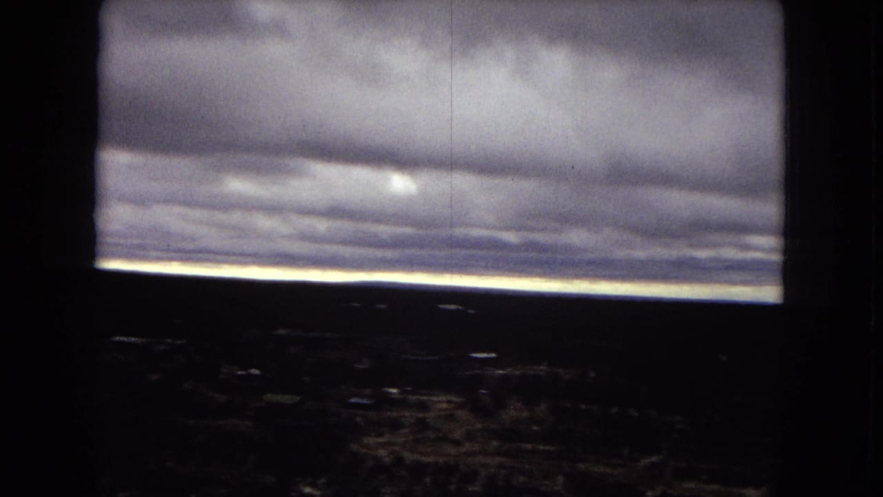 1967 8mm footage appears to show a dark storm front over the Grand Canyon, with the canyon mostly in silhouette below a bright horizon line.