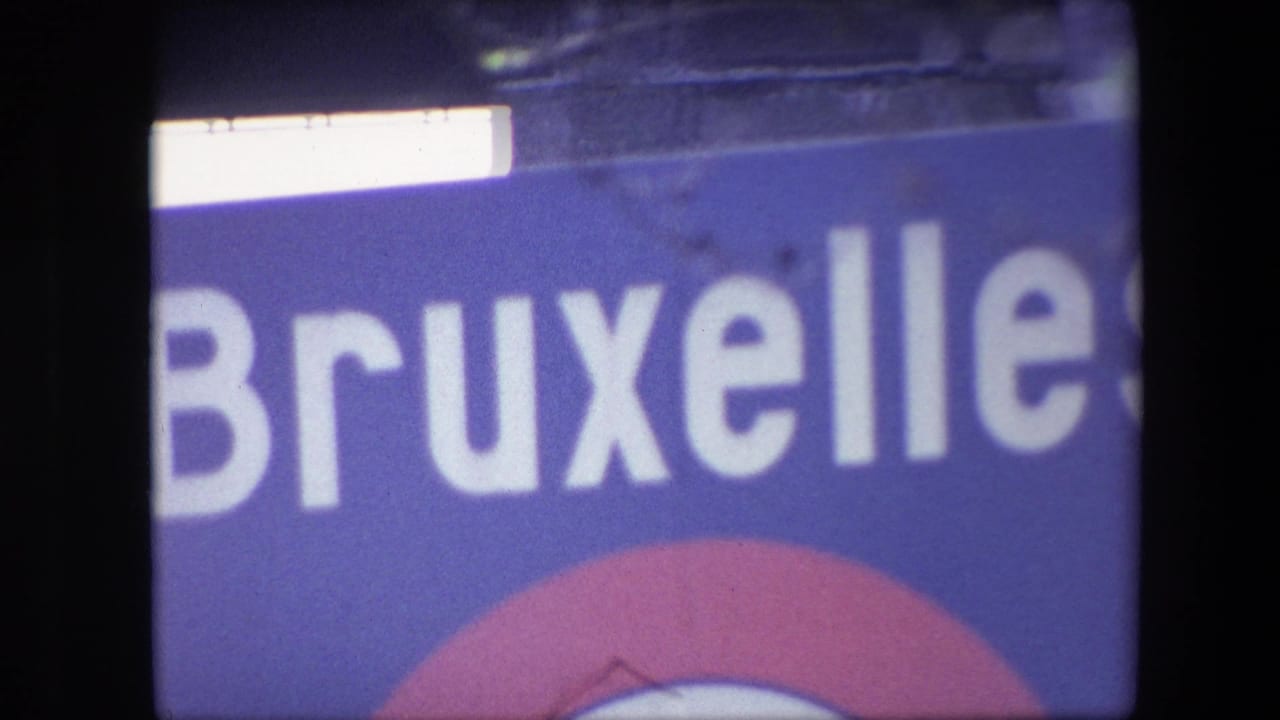 Very close 1967 Brussels frame with soft-focus Bruxelles lettering filling the sign area and the top of the red 60 km/h roundel visible below.