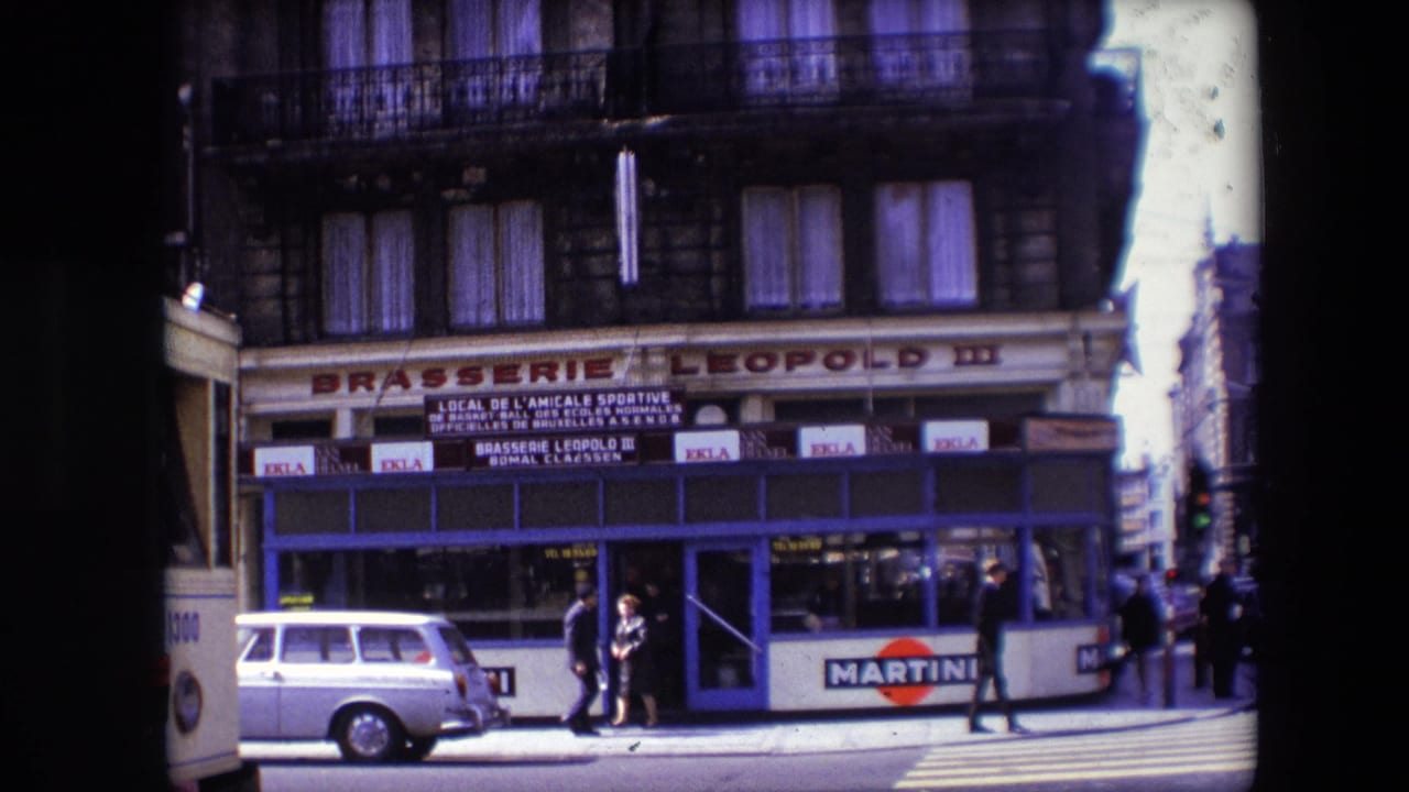 1967 Calais street view showing Brasserie Leopold III with blue storefront trim, pedestrians on the sidewalk, a light station wagon, and Martini advertising along the lower facade.