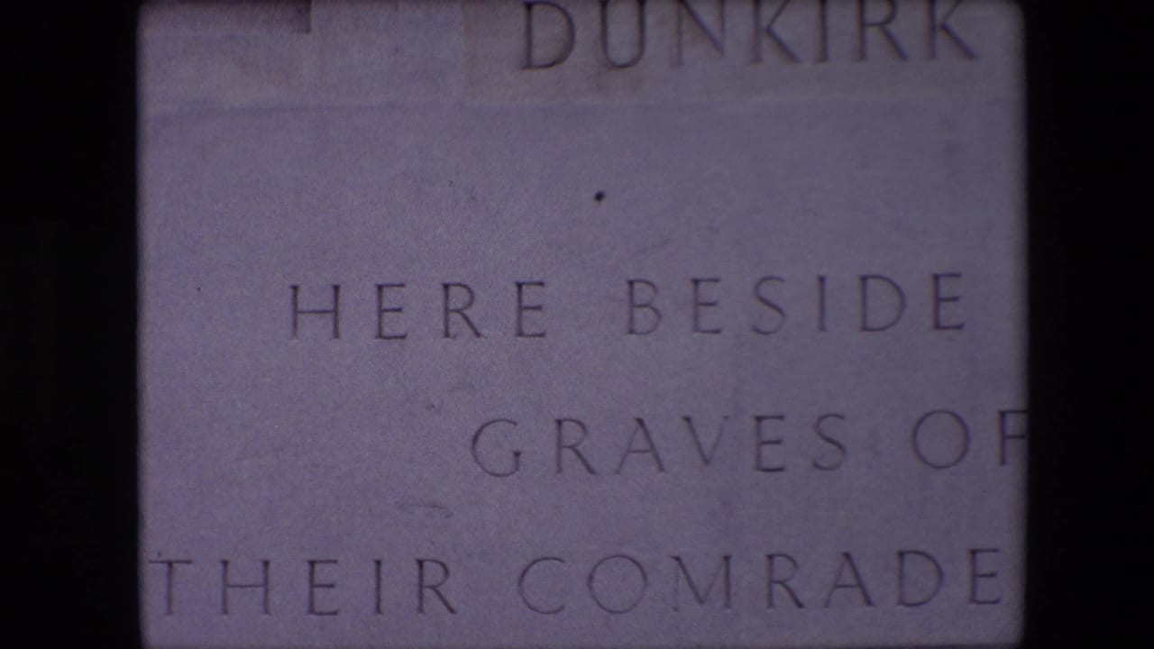Close-up of pale stone inscription with Dunkirk and partial commemorative wording.