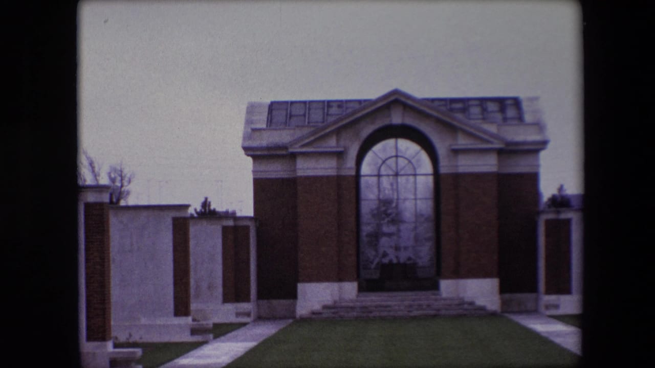 Memorial building seen closer with the arched glass panel centered.