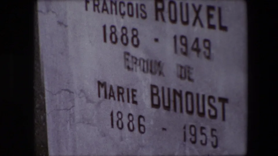 Tight 8mm frame of the Calais headstone inscription, showing François Rouxel, Marie Bunoust, and their recorded dates.