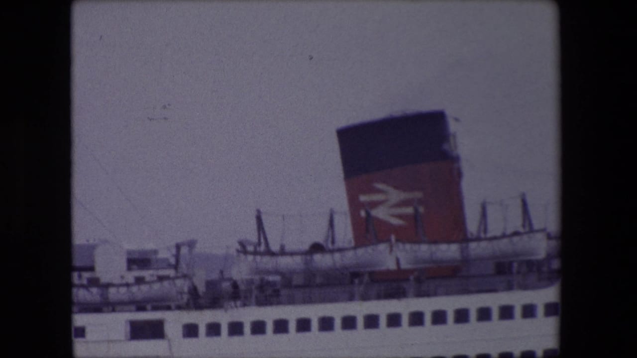 Passenger ferry side with red-and-black funnel and British Rail logo under a grey sky.