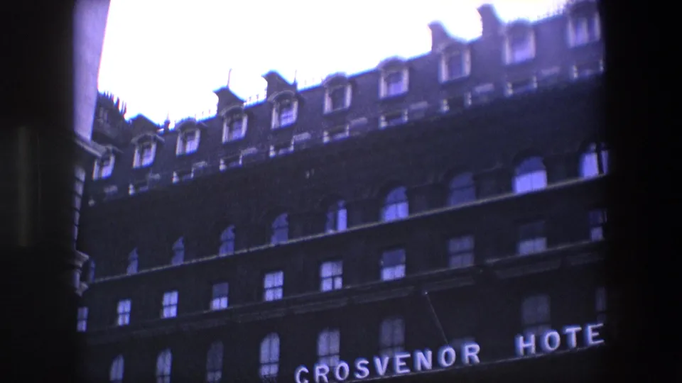 Upward-looking 1967 London view of the Grosvenor Hotel facade, showing upper windows, dormers, and partial hotel lettering.