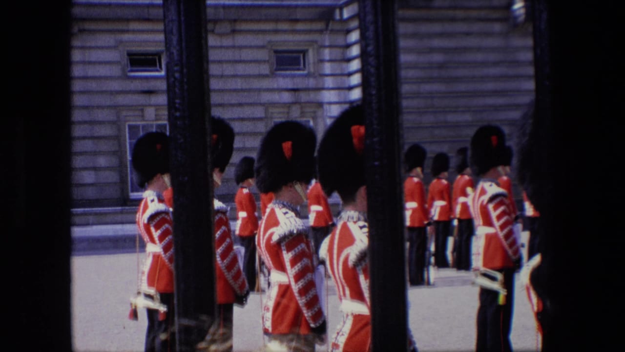 Ceremonial guards standing in formation beside a stone building.