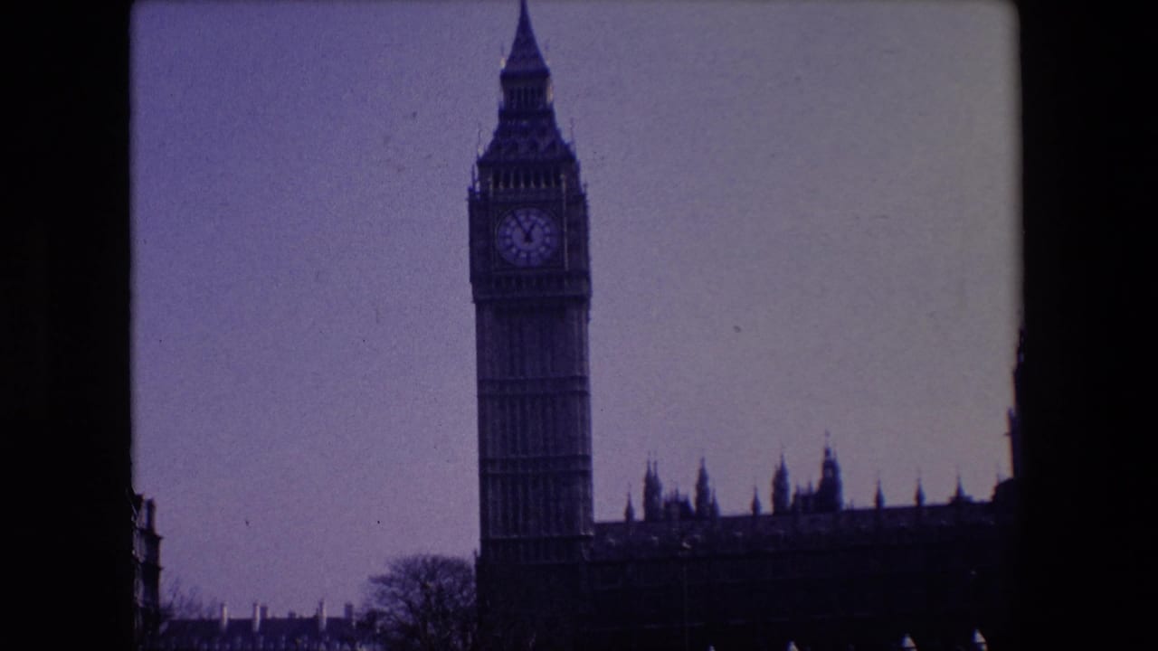 Big Ben centered high in frame with the Houses of Parliament extending to the right.