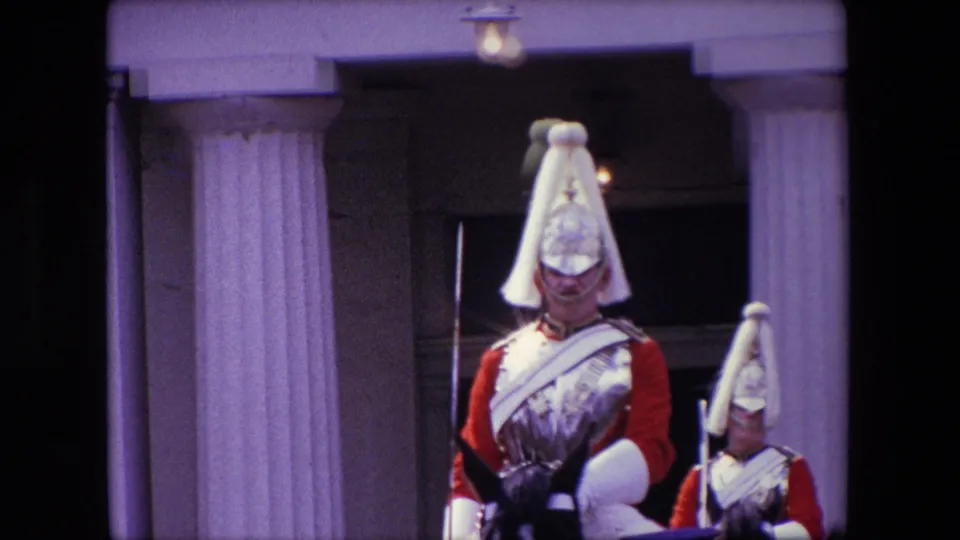 The final frame gives a closer look at two mounted cavalrymen in red and metal dress uniforms beside a columned entrance, consistent with the supplied 1967 London metadata.