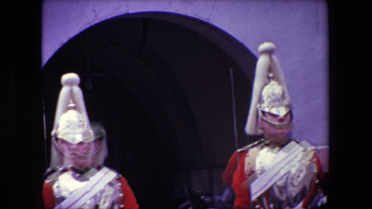 Two mounted ceremonial guards partially visible near a dark arched entrance.