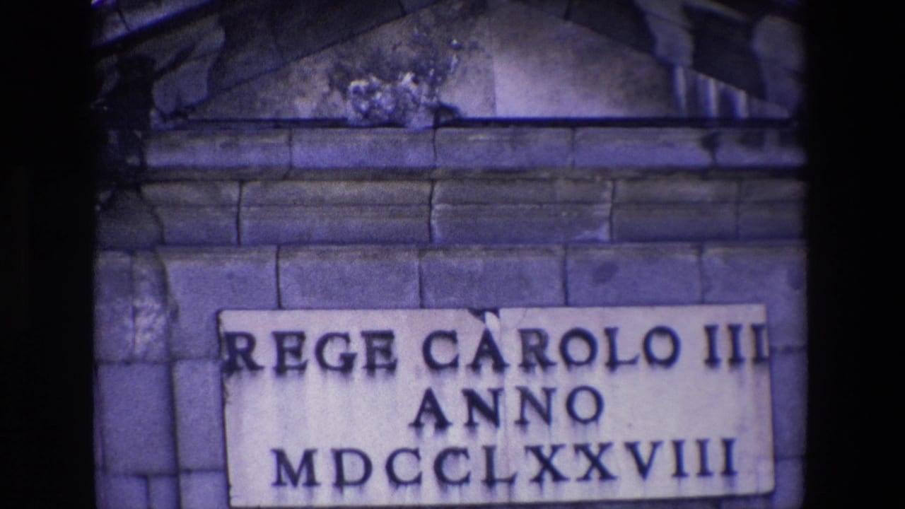 Closer view of the plaque reading REGE CAROLO III ANNO MDCCLXXVIII on a stone wall.