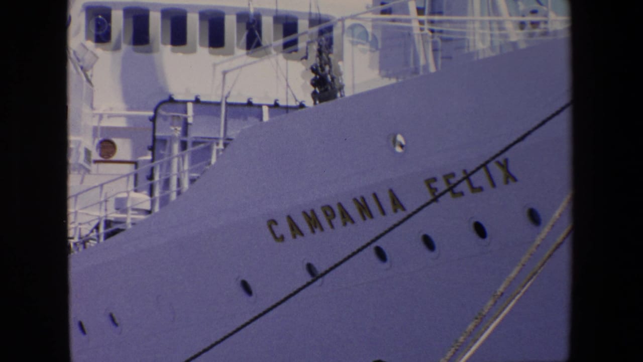 Campania Felix name on a white ship hull with railings above.