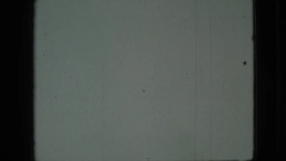 Final 8mm frame from the Branson, Missouri clip showing a mostly blank overexposed section of film with dark borders and faint vertical marks.