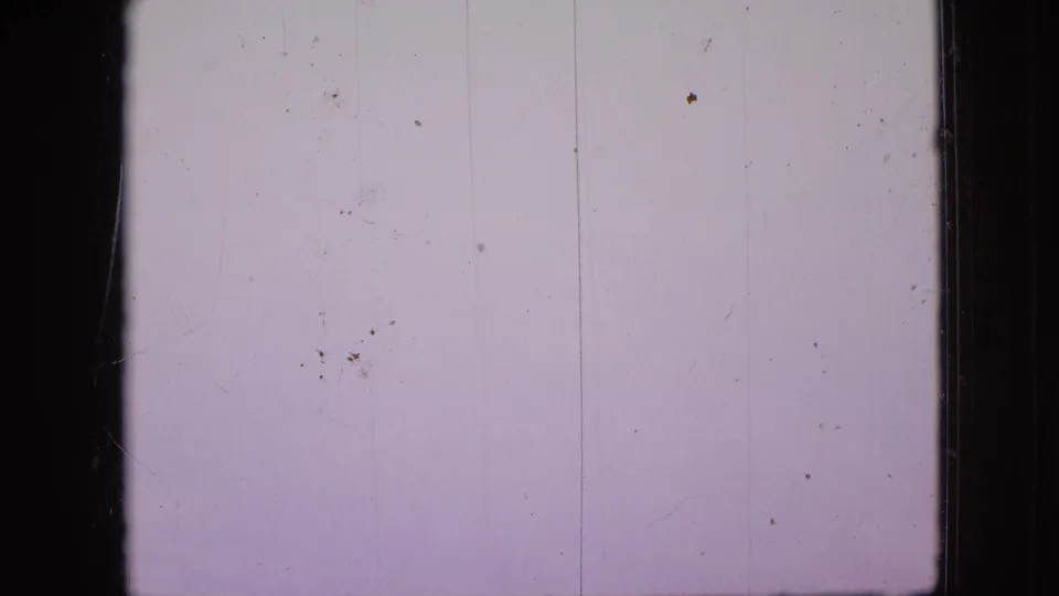 Pale blank 8mm frame from the 1968 Branson vacation reel, showing dust, scratches, vertical marks, and exposed film borders rather than a clear scene.