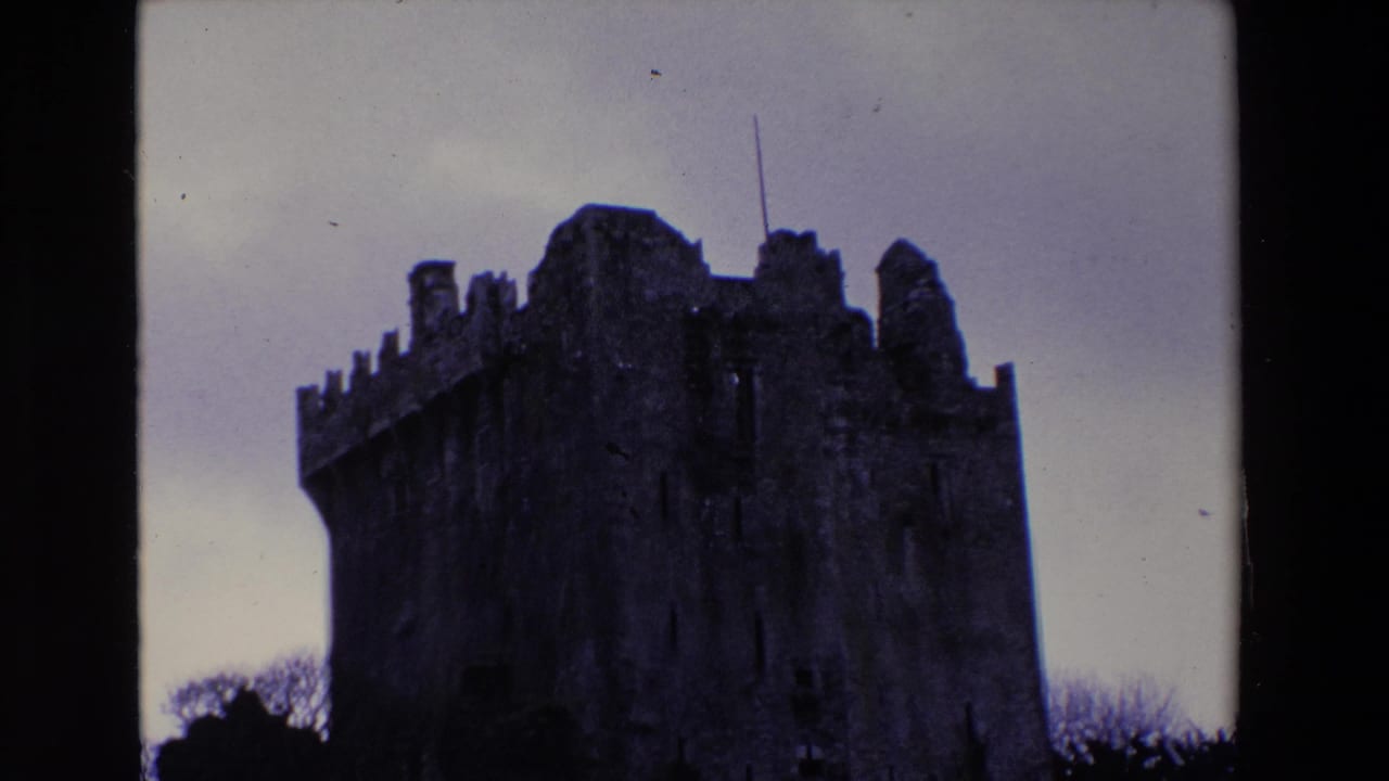 Closer view of the castle's upper stone walls and towers.