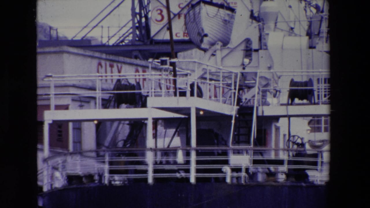 Close 1969 Irish port view of the INNISFALLEN's upper deck area, showing white railings, lifeboat equipment, ladders, and a dark hull section.