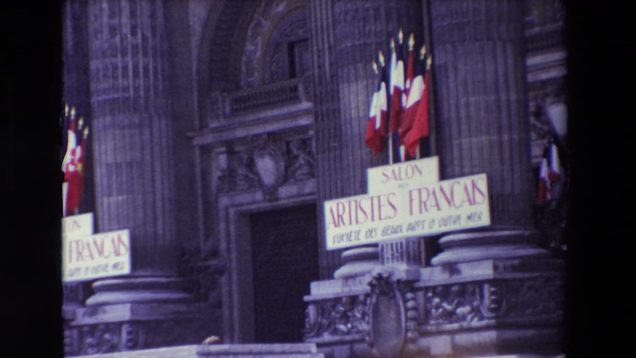 Ornate building entrance with French flags and Salon des Artistes Français signage.