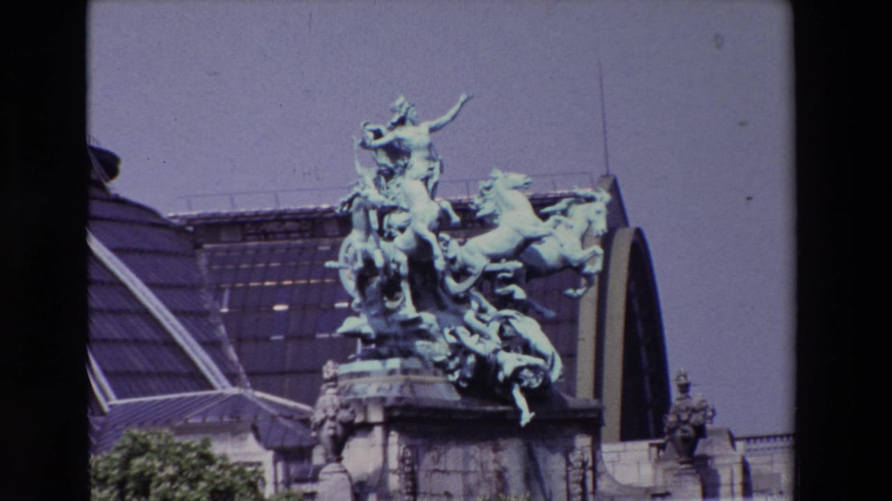 Closer view of a green horse-and-figure sculpture against a glass roof.