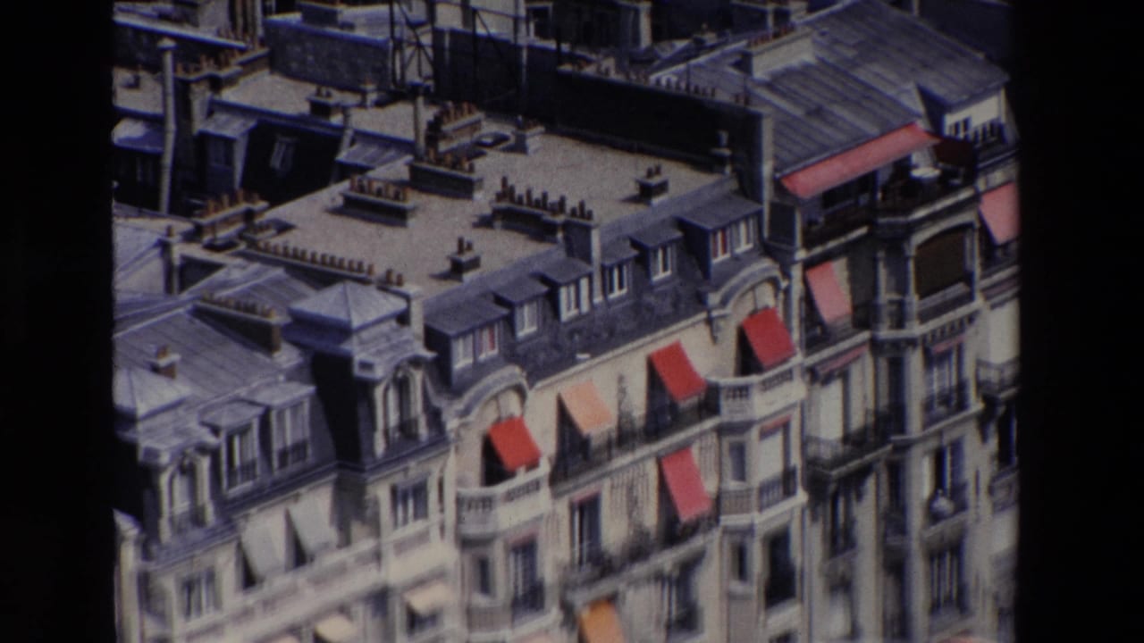 Closer high-angle view of Paris apartment rooflines and awnings.