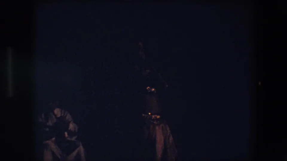 The final 1971 Algeria frame shows a dancer partly silhouetted at right with a seated performer or musician low in the shadows behind her.