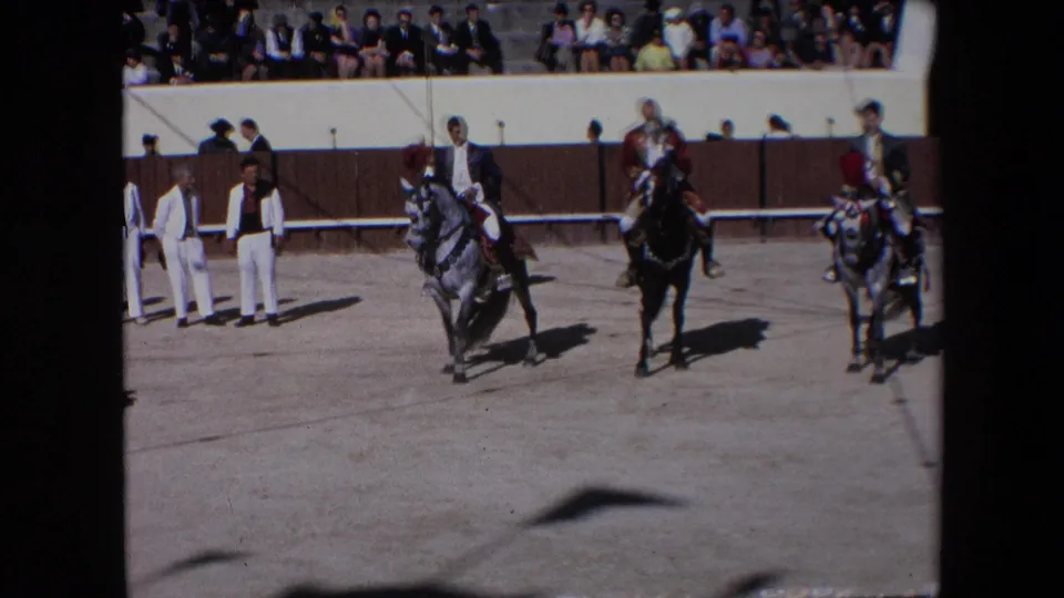 Riders on a grey horse, black horse, and another pale horse continue the ceremonial arena display before a seated Barcelona audience in 1971.
