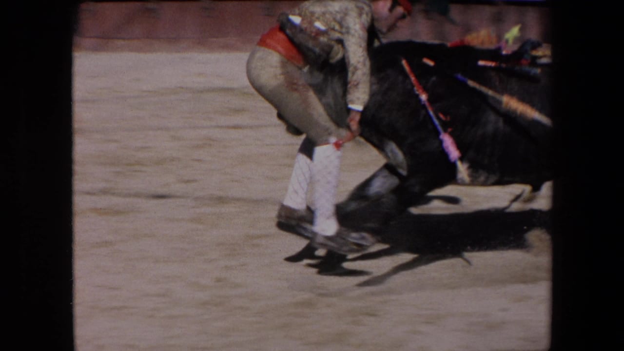 A closer 1971 Barcelona frame shows a bullfighter at the black bull's side, with another man leaning in as the action tightens near the animal's head and horns.