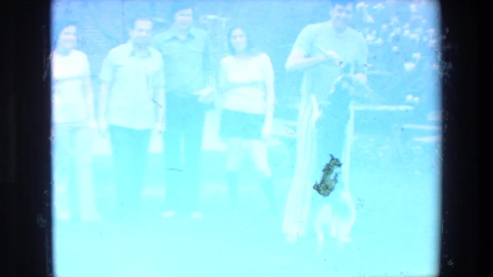 The final 1972 Mazatlan frame is heavily overexposed and blue-tinted, with the adults and dog still faintly visible within the 8mm frame.