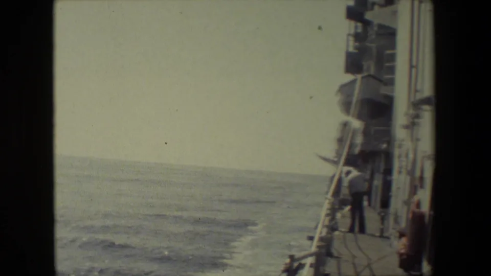 The final frame shows the ship's wake trailing through open water, with the ship's side, railings, deck equipment, and a person visible near the right edge.