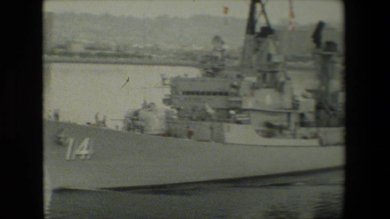 Bow section of a naval ship with hull number 14 visible near the front.