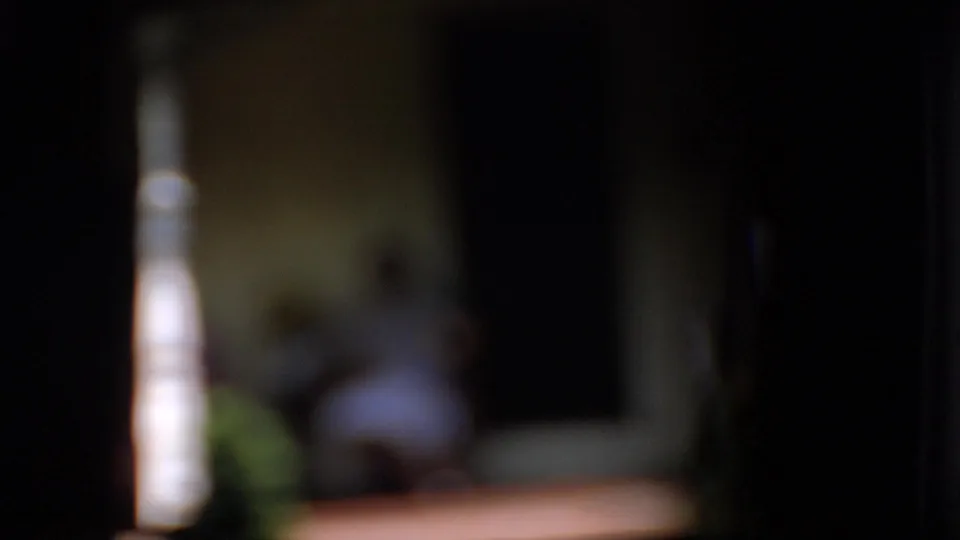 A blurred 8mm frame shows the same shaded porch setting with seated women, a bright white column, greenery, and warm porch flooring.