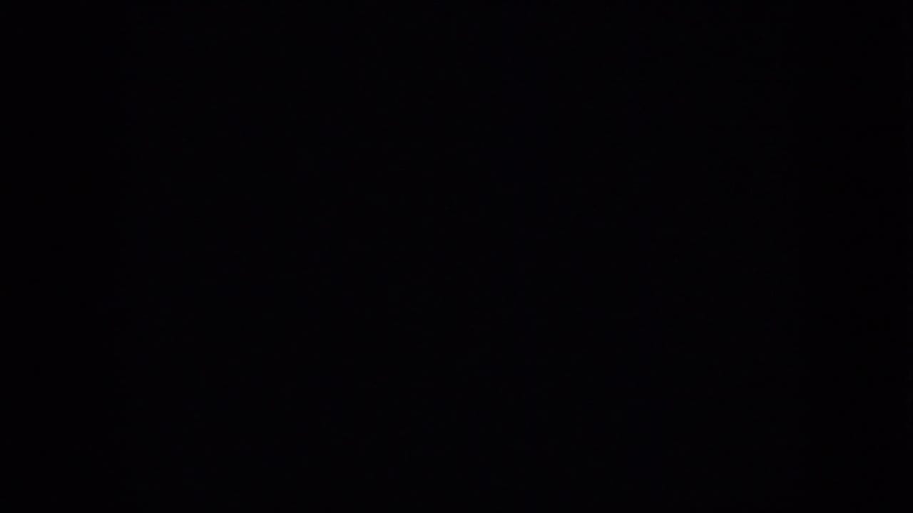 Nearly black 8mm frame from the 1958 Pennsylvania underwater clip, likely a brief gap or underexposed transition between visible shots.
