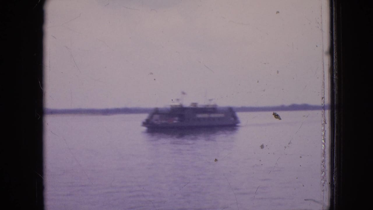 The passenger boat appears farther across the water in the 1964 Philadelphia clip, with a pale overcast sky, low shoreline, and visible film-gate borders.