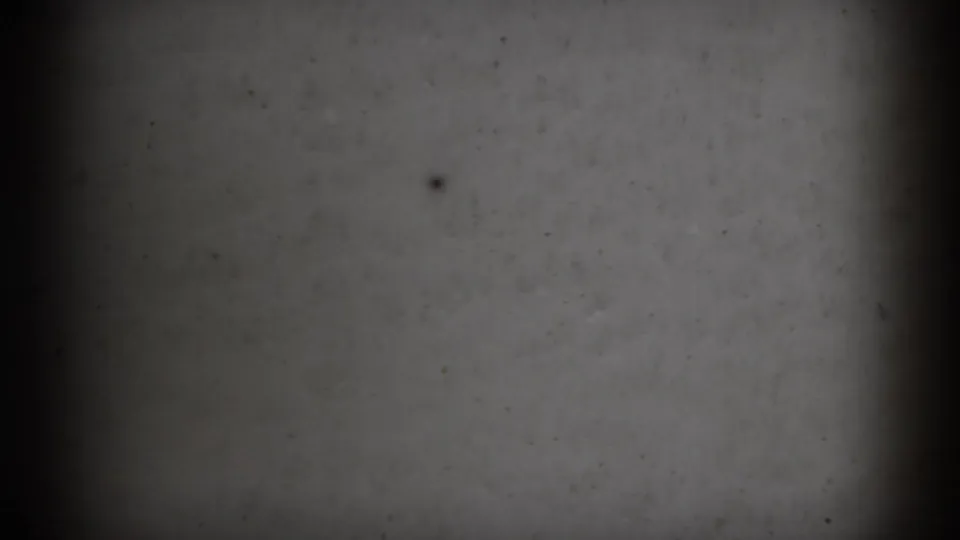 1966 Athens, Ohio 8mm frame showing a soft gray blank television-like screen surface with darkened edges, vertical banding, and visible film dust.