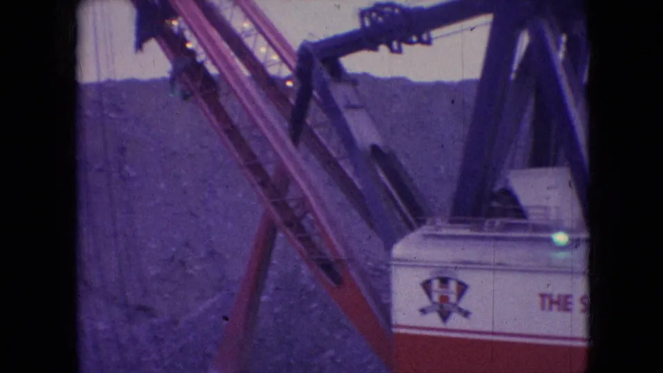 1966 8mm frame from Athens, Ohio showing a partial view of the Silver Spade housing beneath the angled boom and cables.