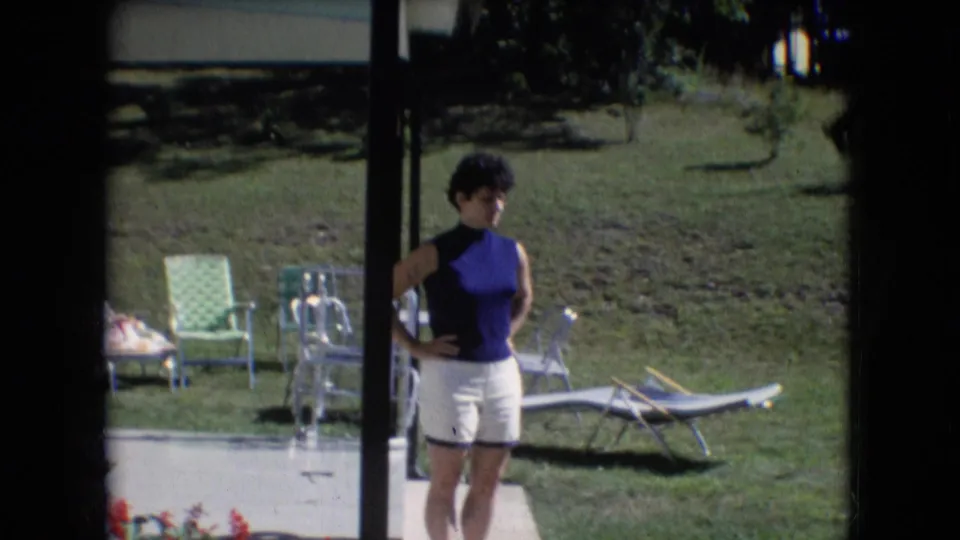 The final frame gives a closer 8mm view of the woman posing beside a porch post in Athens, Ohio, with a lawn, chairs, and a lounge chair visible in bright sunlight.