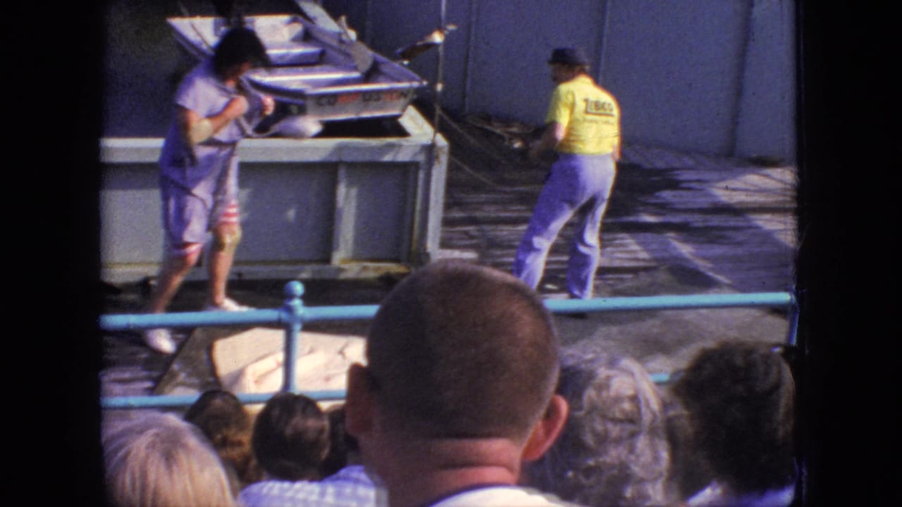 A dockside moment from the 1966 New Jersey pier show shows two performers or staff near a small boat, with the audience visible in the foreground.