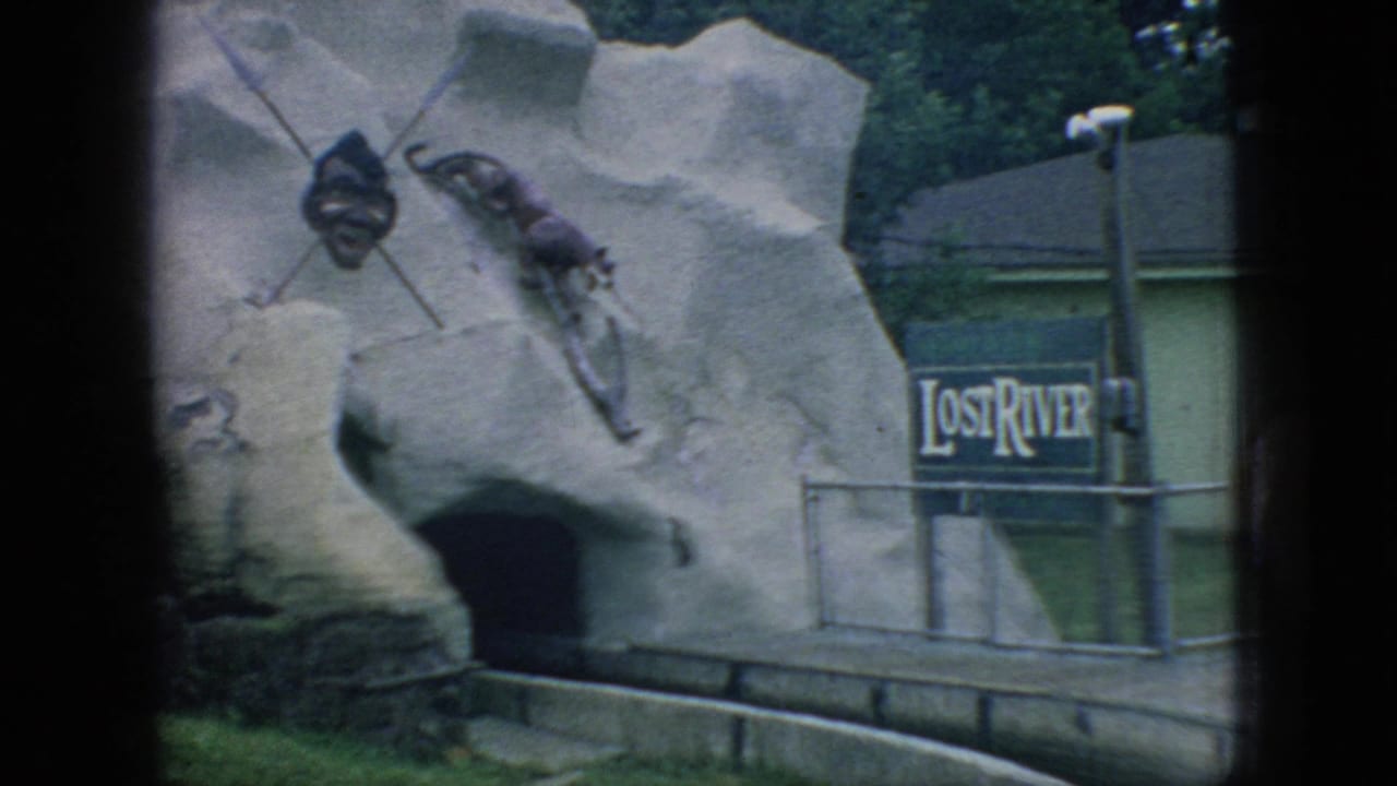 1966 New Jersey 8mm frame with a clearer view of the Lost River sign, simulated cave opening, railings, and themed objects mounted on the rock facade.