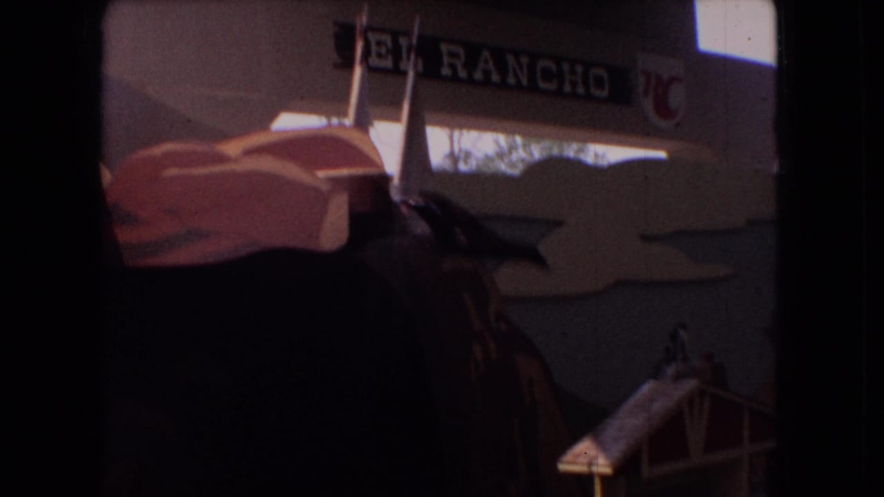 Show structure with an El Rancho sign above a pool area.