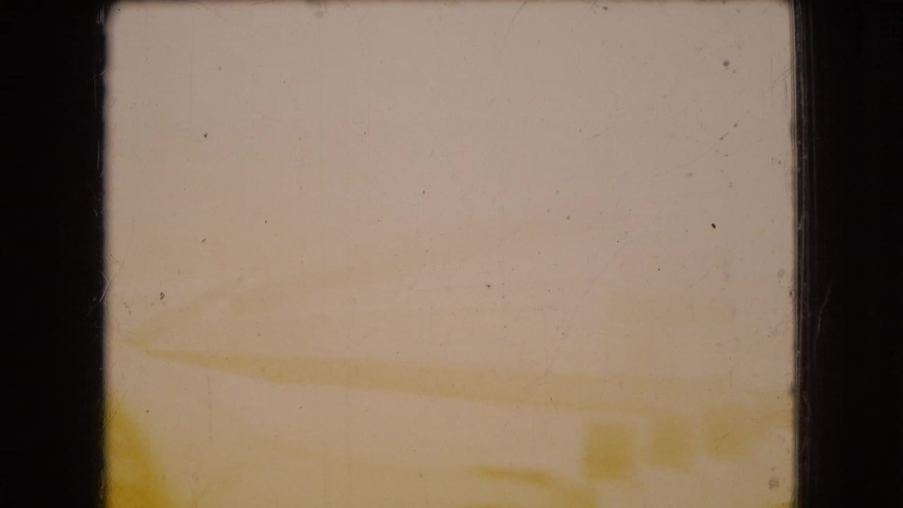 1966 Ohio 8mm frame showing a heavily faded, soft-focus view with faint exterior lines and no identifiable people, brands, or landmarks.