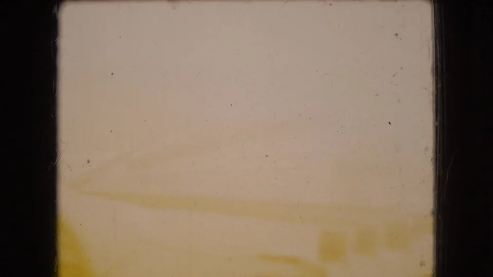 1966 Ohio 8mm frame showing a heavily faded, soft-focus view with faint exterior lines and no identifiable people, brands, or landmarks.