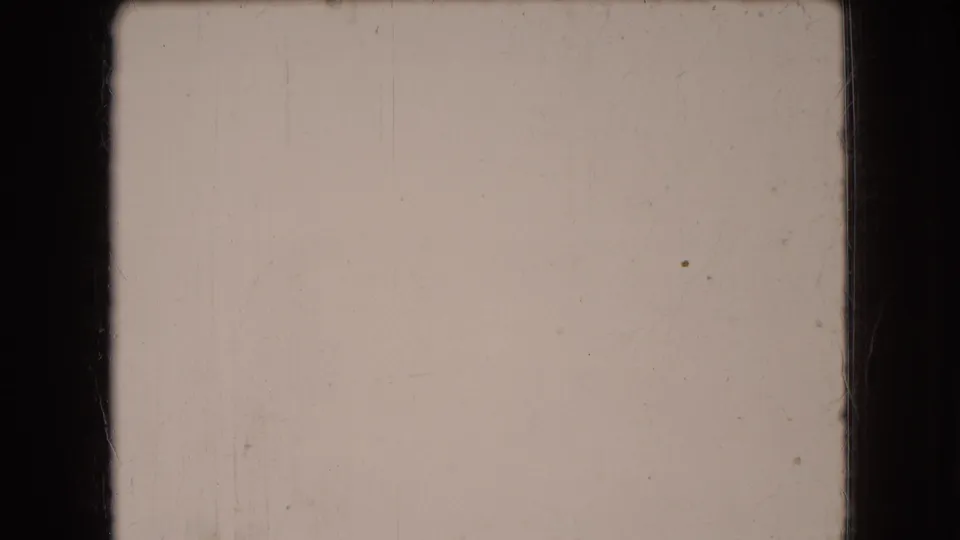 1966 Ohio 8mm home-movie frame reduced to a pale overexposed field, with visible scratches, dust, and film gate edges but no distinct subject.