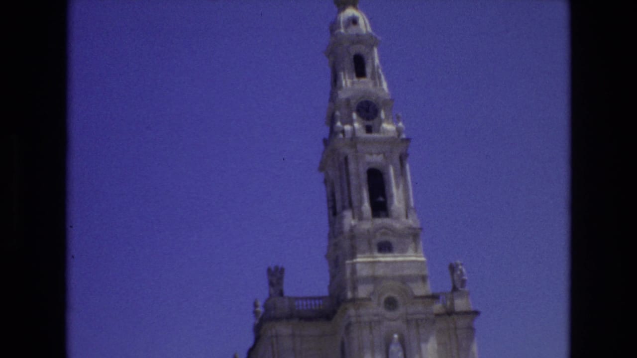 Cathedral tower shifted right within a blue-sky frame.