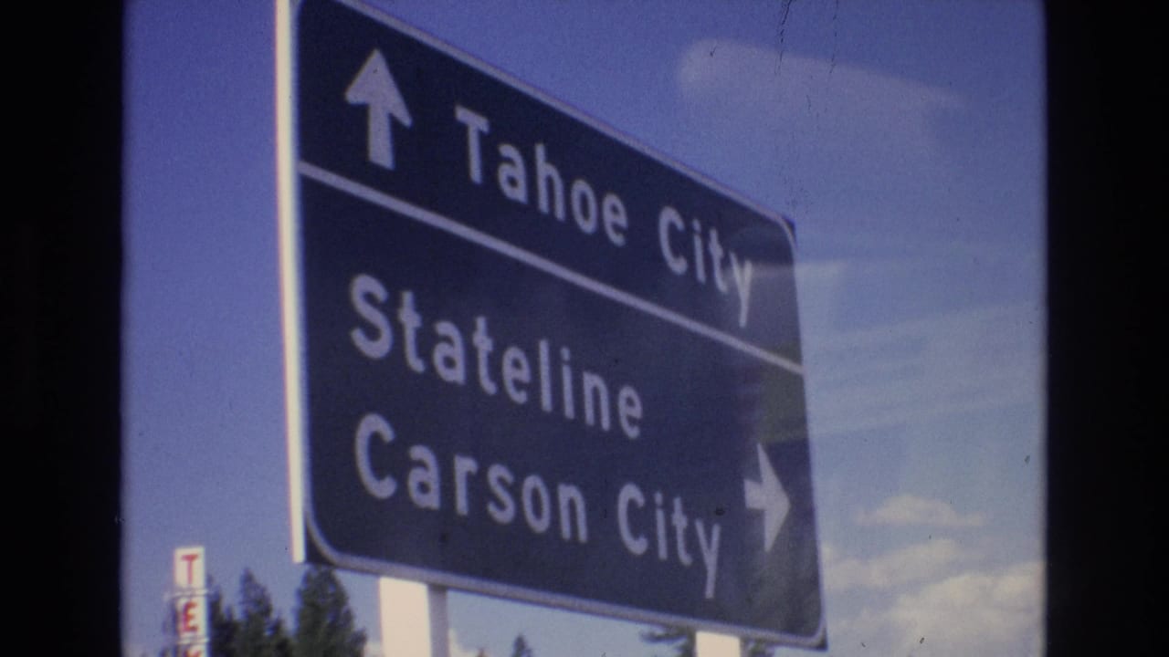 Blue highway sign pointing toward Tahoe City, Stateline, and Carson City.