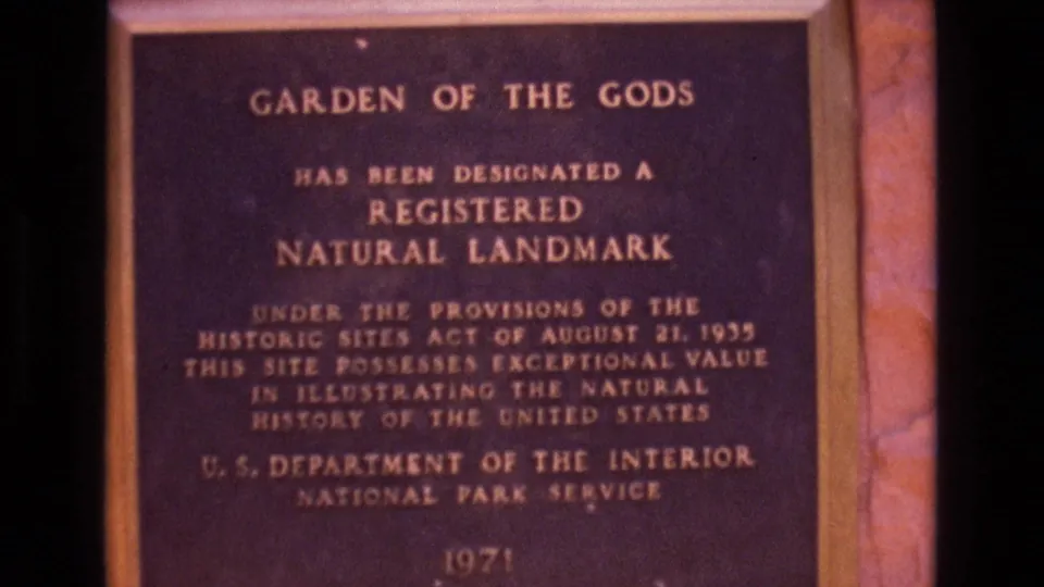 Close view of the Garden of the Gods Registered Natural Landmark plaque, including National Park Service text and a 1971 date.