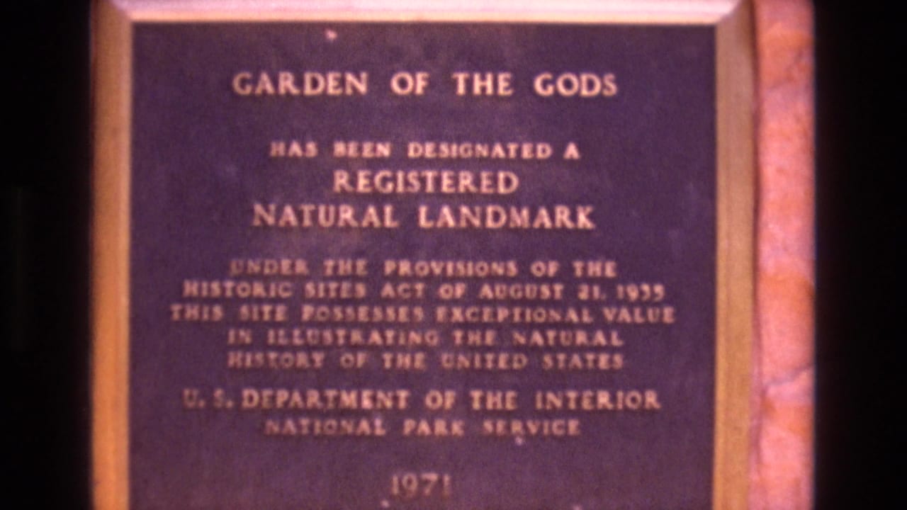 Garden of the Gods plaque framed slightly right of center.