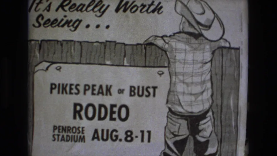 1973 Colorado Springs frame showing the Pikes Peak or Bust Rodeo poster with the slogan above, Penrose Stadium text below, and a cowboy leaning on a fence.