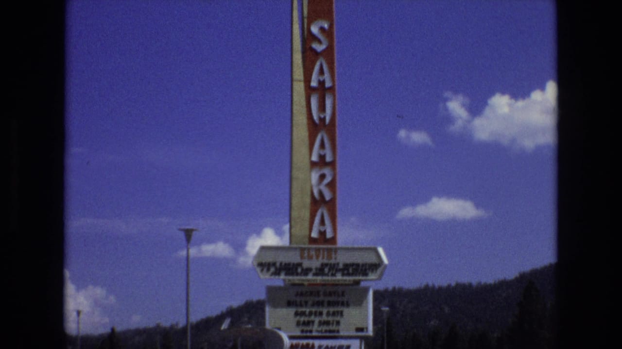 Tall Sahara sign and marquee against a blue sky.